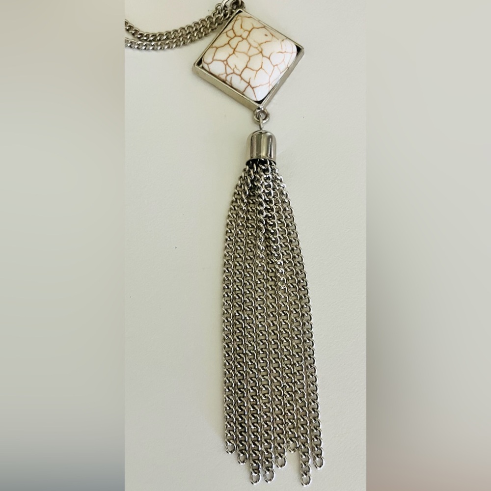 Silver-tone tassel pendant necklace featuring a square white howlite stone